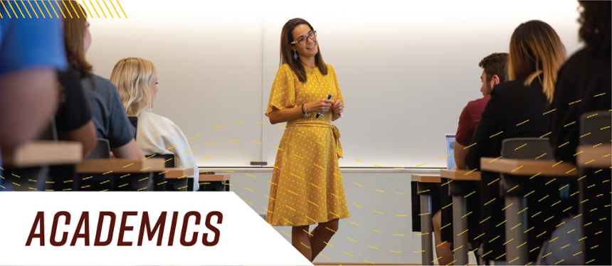 Banner text: Academics. Image shows classroom of students and a professor