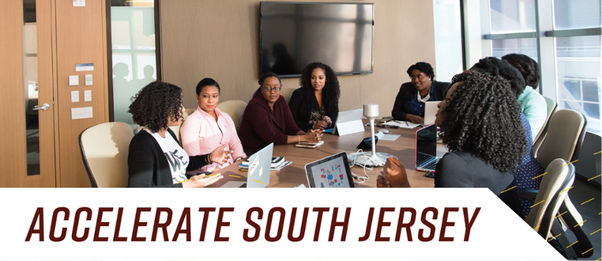 Banner text: Accelerate South Jersey. Image shows people sitting down at a table